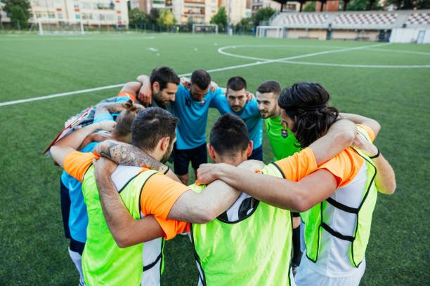 Group of male soccer player getting ready and motivated for the upcoming match.